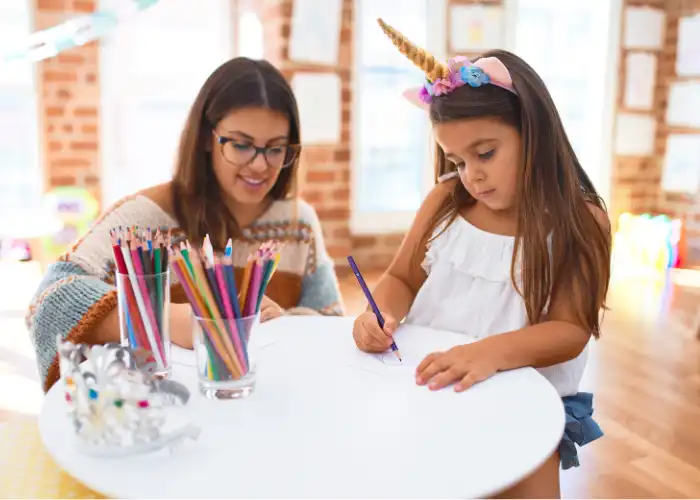 Child and teacher engaged in creative learning with printable Coloring Pages A To Z Worksheet